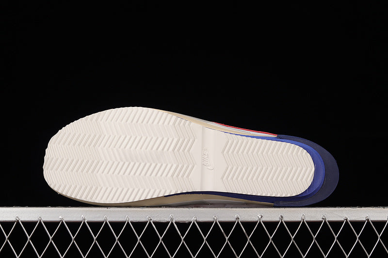Zoom Cortez x sacai - White/University Red